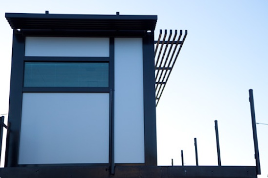 modern-shipping-container-home-2 Sideview of the prefab shipping container house by One Cool Habitat